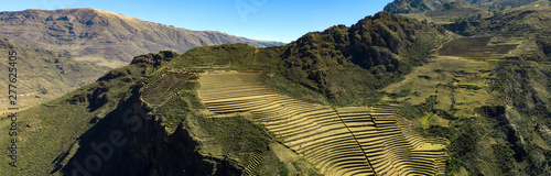 Aerial panoramic view of the ancient Inca ruins of Pisac (Pisaq) in the Sacred Valley near Cusco, Peru. Archaeological park with green terraces. photo