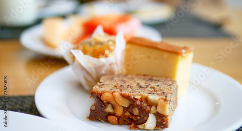 Delicious banana cake with Cashew nuts and other type of cakes for morning that placed on table.