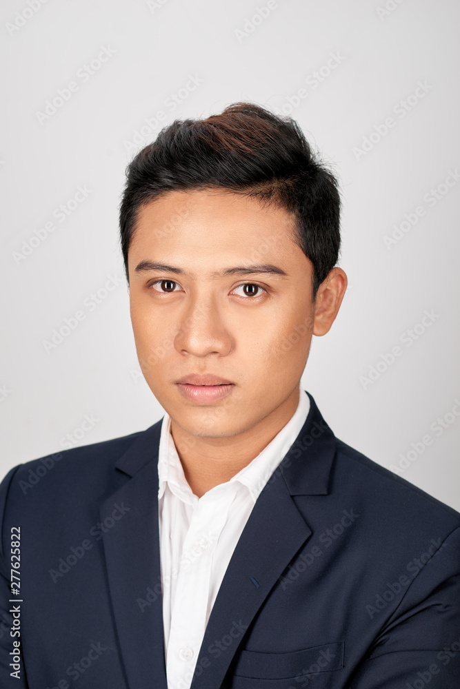 Portrait of serious businessman in suite on white background Portrait of serious businessman in suite on white background