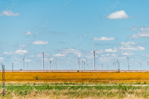 Wind turbine farm generator near Roscoe or Sweetwater Texas in USA in prairie with rows of many machines for energy photo
