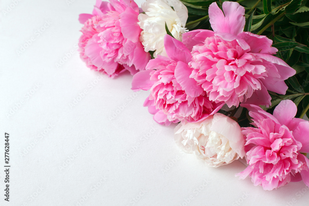 Flowers frame on white wooden background. Seasonal holiday romance, saint valentine, 8 march, mother, womane day celebration, Top view with copy space Flowers frame on white wooden background. Seasonal holiday romance, saint valentine, 8 march, mother, womane day celebration, Top view with copy space