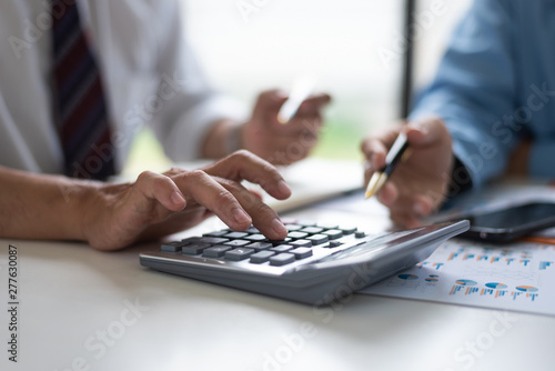 Business Asian middle age people using calculator to calculating finance bills.