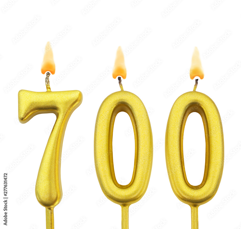 golden birthday candle isolated on white background, number 700 golden birthday candle isolated on white background, number 700