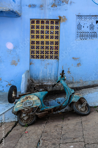 blue motorcycle in the city of Johdpur photo