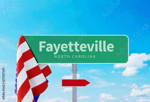 Fayetteville – North Carolina. Road or Town Sign. Flag of the united states. Blue Sky. Red arrow shows the direction in the city photo