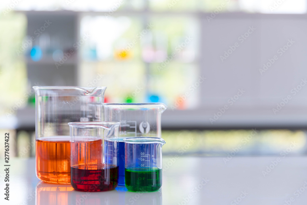 The beaker on the whit desk in laboratory. The beaker on the whit desk in laboratory.