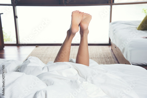 Women relax with beautiful legs on the mattress