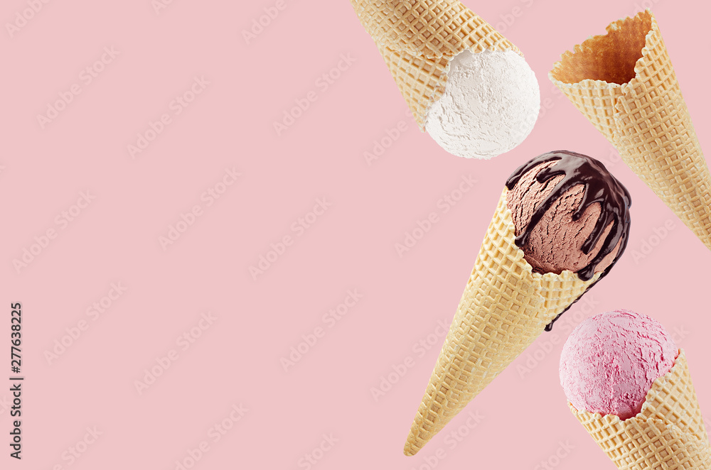 Decorative border of fly different flavor ice cream cones in waffle - white, pink, brown with chocolate sauce on pink. - obrazy, fototapety, plakaty 
