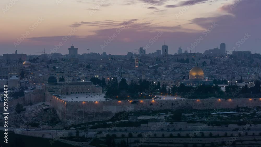 Beautiful panoramic aerial time lapse of the Old City and Dome of the Rock during a dramatic colorful sunset. Taken in Jerusalem, Capital of Israel. Beautiful panoramic aerial time lapse of the Old City and Dome of the Rock during a dramatic colorful sunset. Taken in Jerusalem, Capital of Israel.