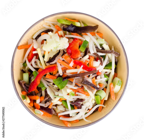 Mix vegetables with chinese mushrooms in bowl on light background