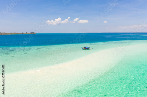 Mansalangan sandbar, Balabac, Palawan, Philippines. Tropical islands with turquoise lagoons, view from above. Boat and tourists in shallow water. © Tatiana Nurieva