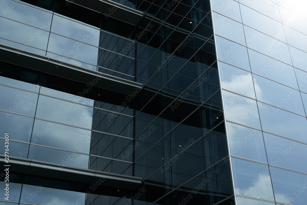 Obraz premium Abstract steel and glass facade detail background of high rise commercial building .Business or industrial successful concept background .