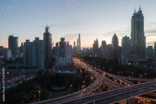 aerial view of buildings and highway interchange at dawn in Shanghai city © Bob