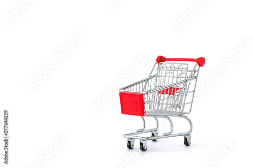 Empty shopping cart on white background. Close-up of shopping trolley on with some copy space. Consumer concept. Online shopping concept. 