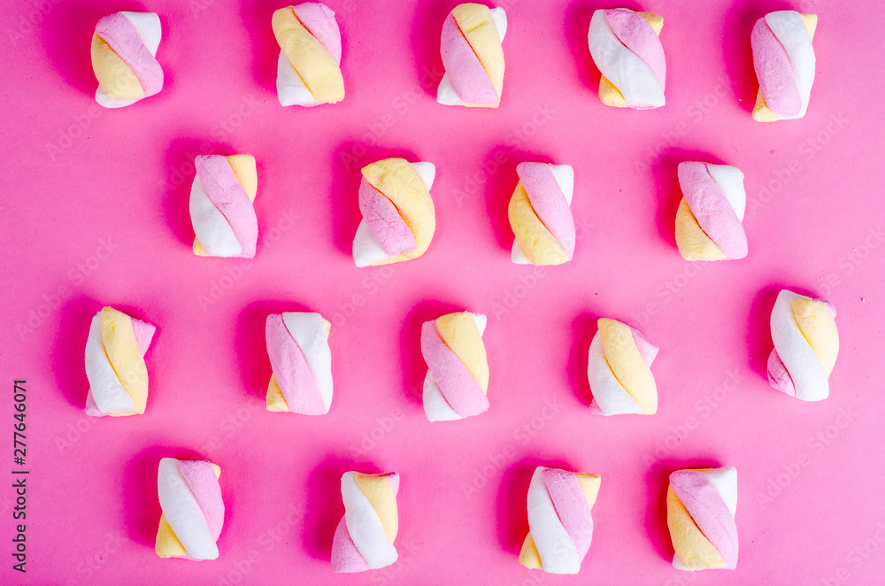 Colorful marshmallow lay out pastel paper background, creative textured pattern Colorful marshmallow lay out pastel paper background, creative textured pattern