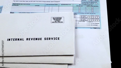 Three mails from the Internal Revenue Service on 1040, Schedule D form 1040 and 1040a tax forms