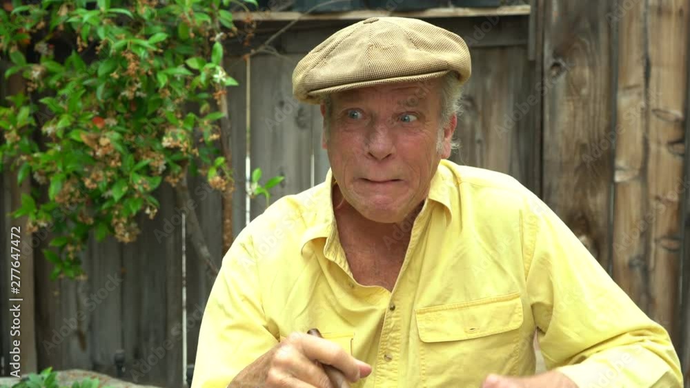 Handsome mature male making goofy faces and gestures. Concept happy and fun character. Holding a cigar in his hand. Handsome mature male making goofy faces and gestures. Concept happy and fun character. Holding a cigar in his hand.
