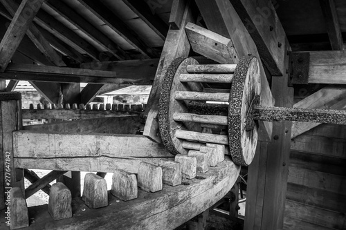 Wooden pin and cog mechanism from a cider mill