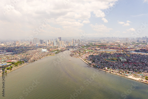 Cityscape Manila. Residential areas and business center in the city, top view. Big port city. The capital of the Philippines. © Tatiana Nurieva