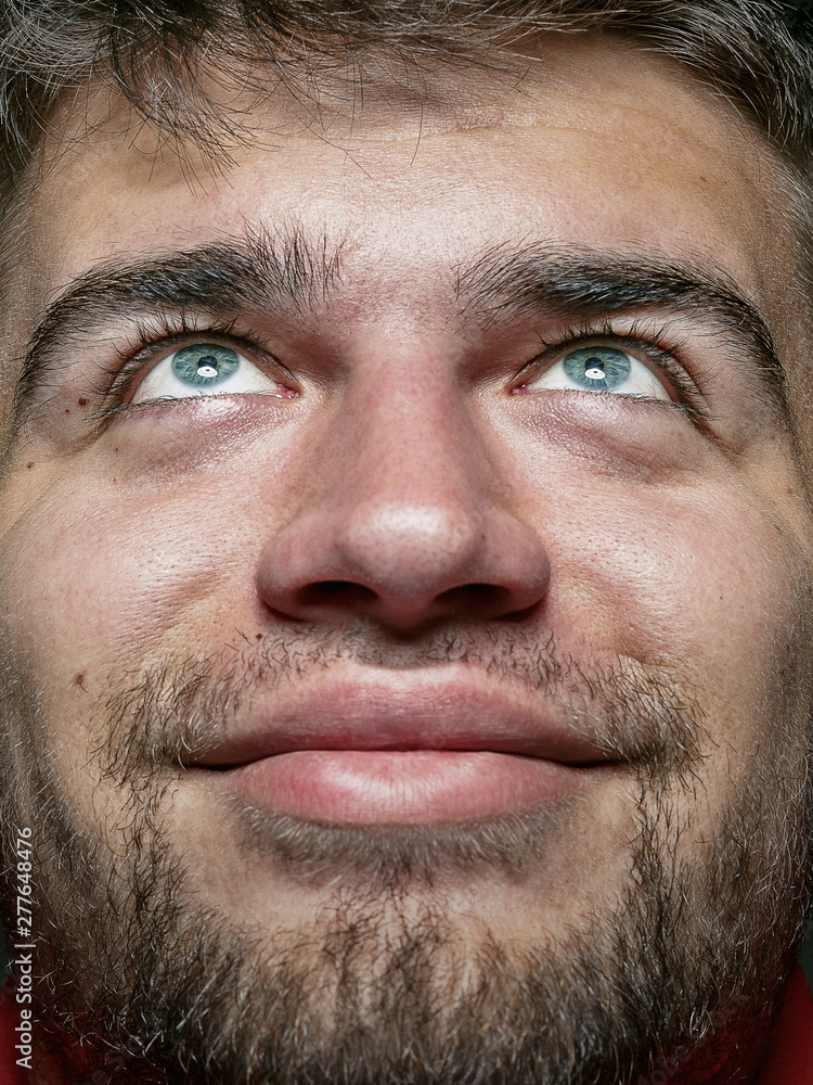 Close up portrait of young and emotional caucasian man. Highly detail photoshot of male model with well-kept skin and bright facial expression. Concept of human emotions. Smiling and looks happy. Close up portrait of young and emotional caucasian man. Highly detail photoshot of male model with well-kept skin and bright facial expression. Concept of human emotions. Smiling and looks happy.