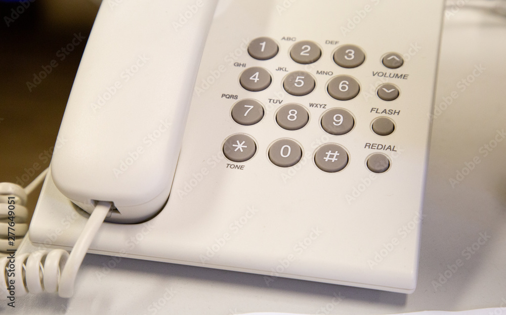 close up soft focus on telephone devices at office desk with light effect,communication technology concept close up soft focus on telephone devices at office desk with light effect,communication technology concept
