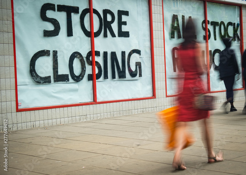 Store Closing sign on shopping high street 
