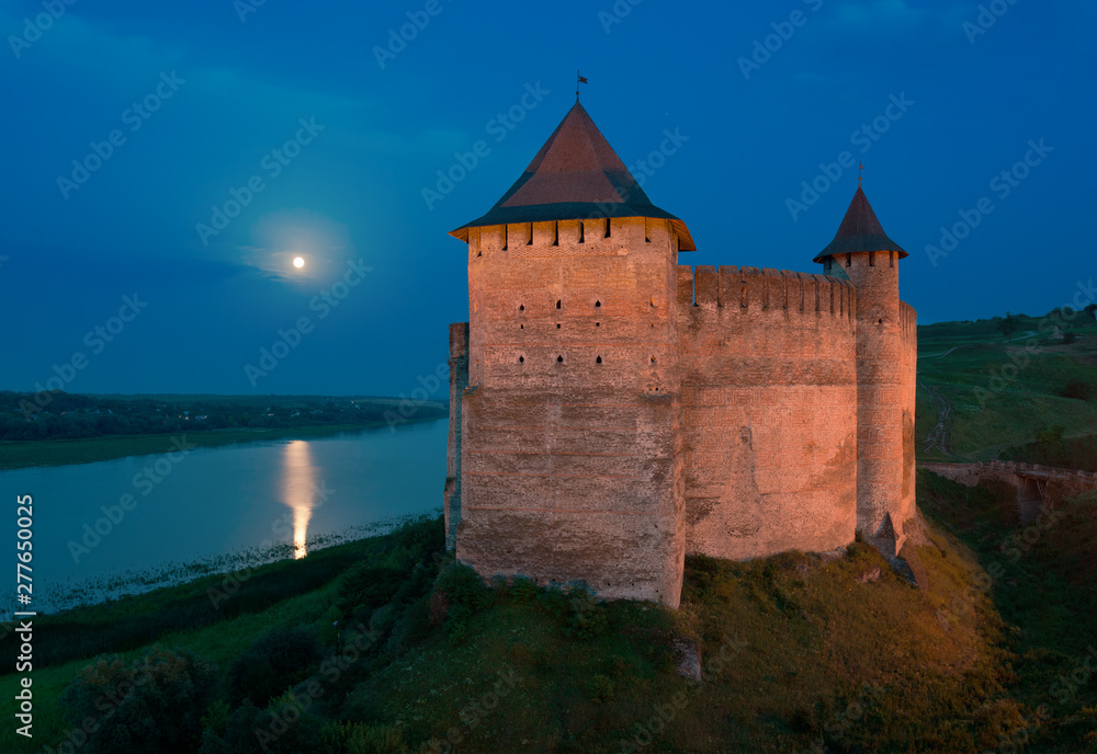 Khotyn Fortress in full moon night