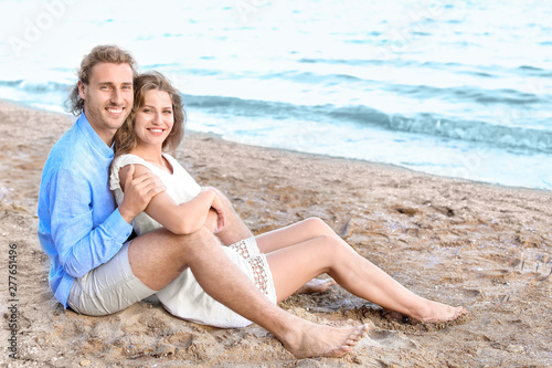 Happy young couple at sea resort © Pixel-Shot