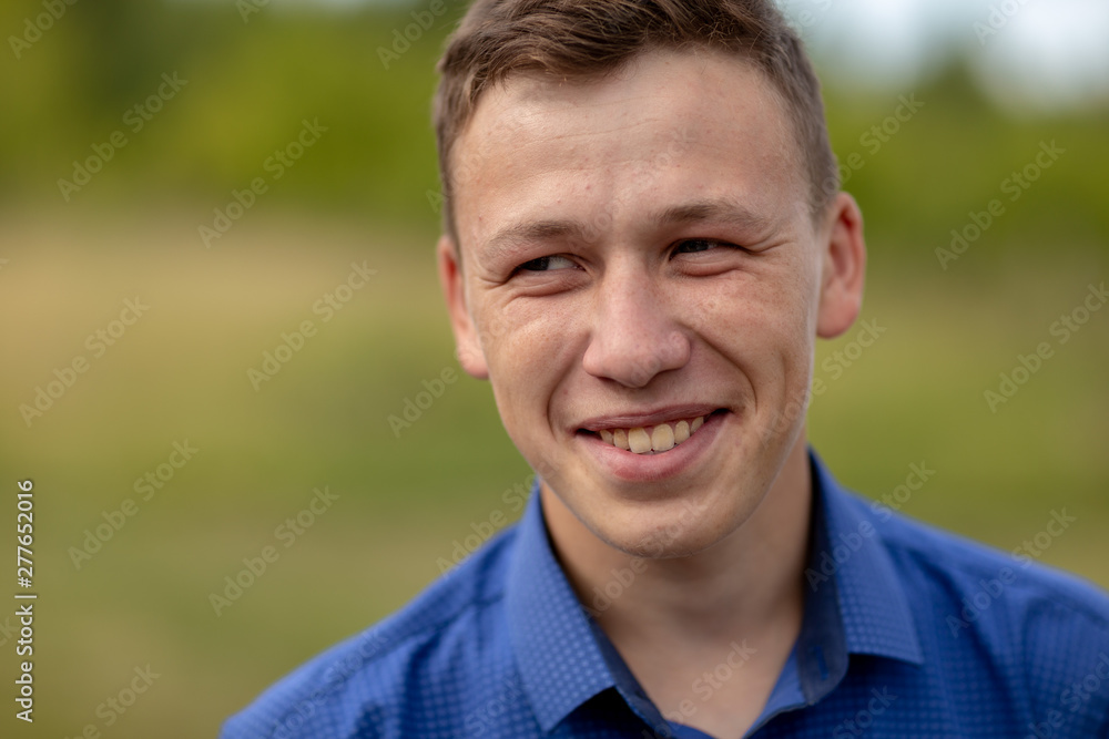 the guy in the blue shirt outdoors on a summer day the guy in the blue shirt outdoors on a summer day