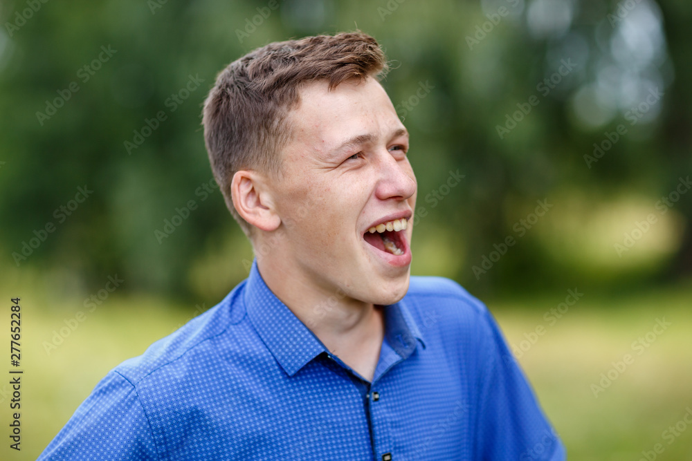 the guy in the blue shirt outdoors on a summer day the guy in the blue shirt outdoors on a summer day
