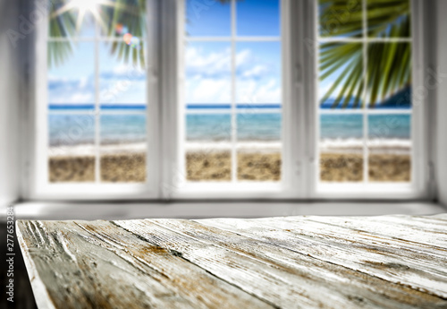 Desk of free space and summer window background 