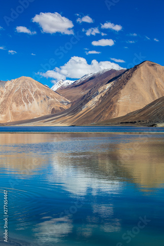 View of majestic rocky mountains against the blue sky and lake Pangong in Indian Himalayas  Ladakh region  India. Nature and travel concept