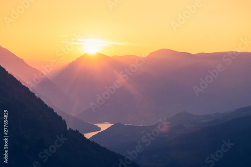 Sunset in mountain landscape.