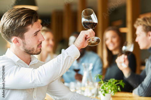 Man with wineglass at a wine tasting