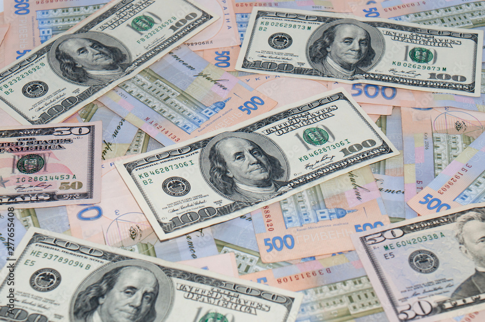 Money, dollars and hryvnia, close-up, top view. The concept of the dollar and the hryvnia, finance, banks. Money, dollars and hryvnia, close-up, top view. The concept of the dollar and the hryvnia, finance, banks.
