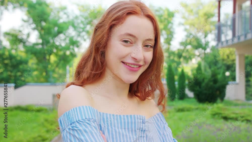 Red-haired lady. Emotion. Smile Closeup shot Red-haired lady. Emotion. Smile Closeup shot