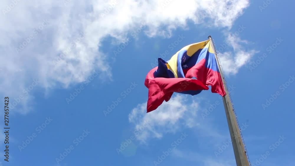 venezuela flag waving in the wind, blue sky cleared. venezuela flag waving in the wind, blue sky cleared.