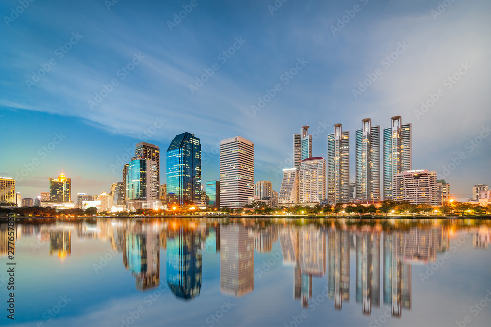 Office buildings reflected in lake with shallow depth of field