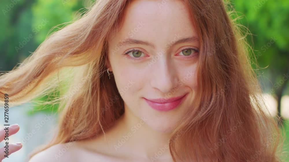 Red-haired lady. Emotion. Smile Closeup shot Red-haired lady. Emotion. Smile Closeup shot