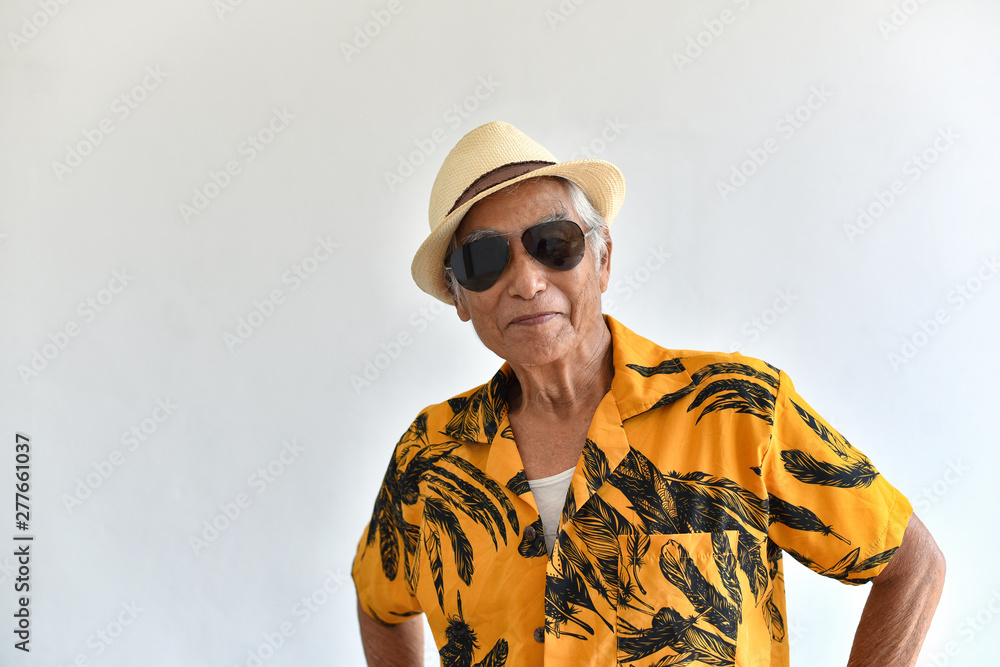 Cheerful asian senior old man, Confident and smiling elderly people with  sunglasses in colorful hawaii shirt, Happy retiree citizen and travel  concept. Stock Photo | Adobe Stock