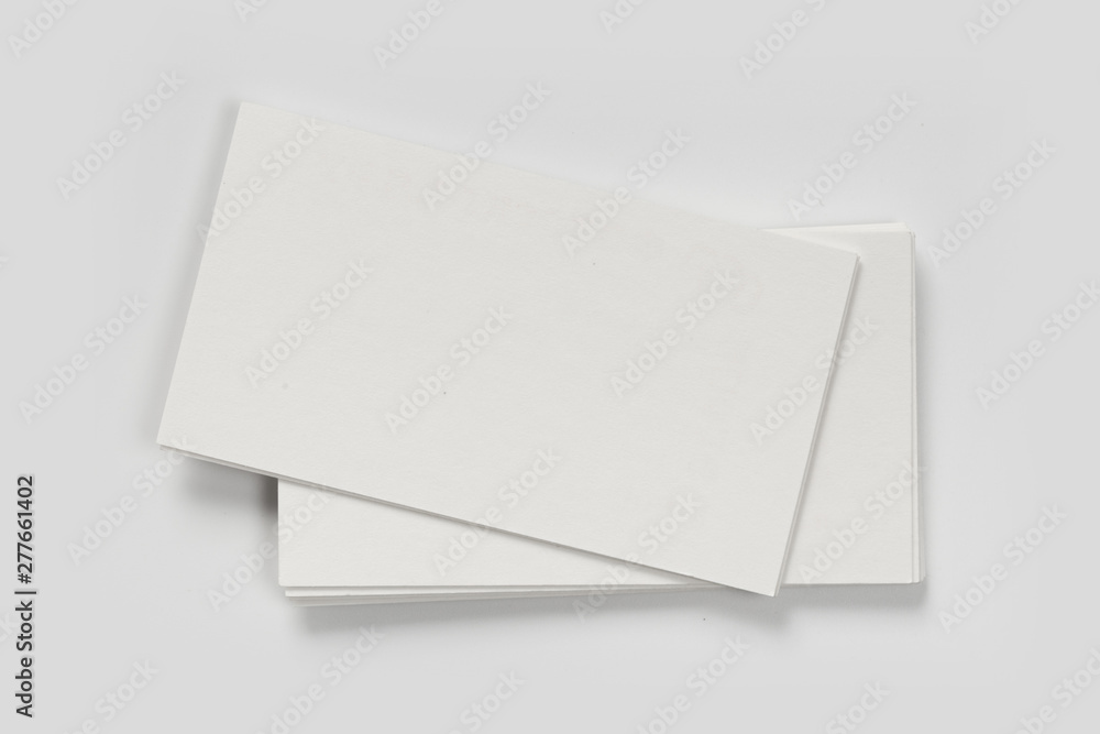 Mockup of business cards stack at white textured background. Design concept. Template for branding identity. Mockup of business cards stack at white textured background. Design concept. Template for branding identity.