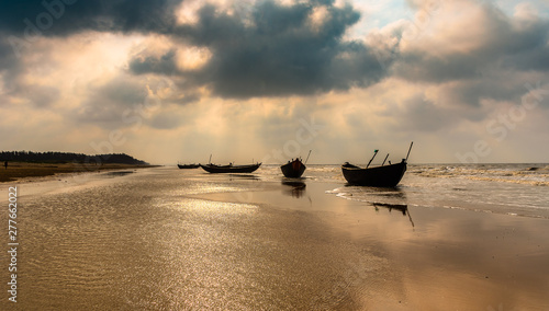 Silhouette Boats anchored on the sea Beach at Digha beach. photo