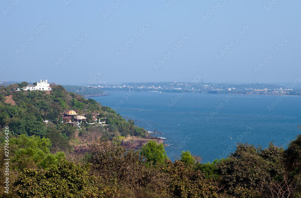 India. Goa View of the sea and the old colonial buildings on the hill...
