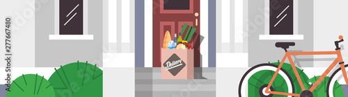 groceries in paper package order left at door grocery products express delivery from shop or restaurant concept modern house building exterior flat horizontal banner