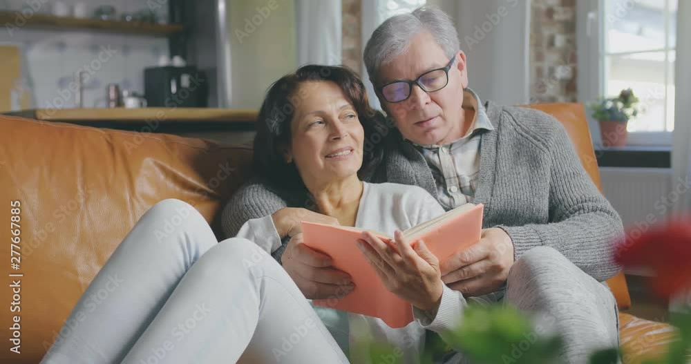Senior couple reading book Senior couple reading book