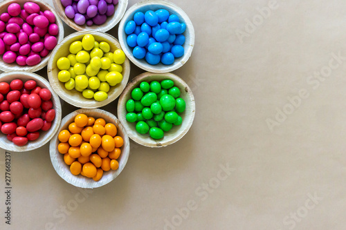 Colorful Rainbow Chocolate Candy on Carton Background