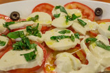 Fresh salad. Natural food. tomato, cheese and basil with olive oil