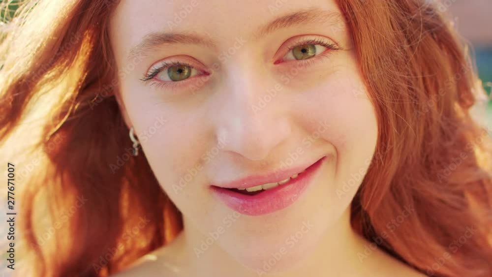 Red-haired lady. Emotion. Smile Closeup shot Red-haired lady. Emotion. Smile Closeup shot