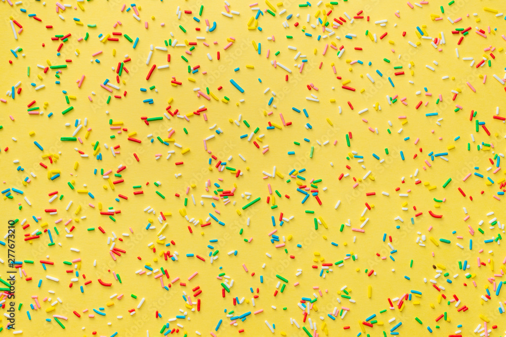 colorful sprinkles over yellow background, decoration for festive  Valentines day, birthday, holiday and party time Stock-Foto | Adobe Stock