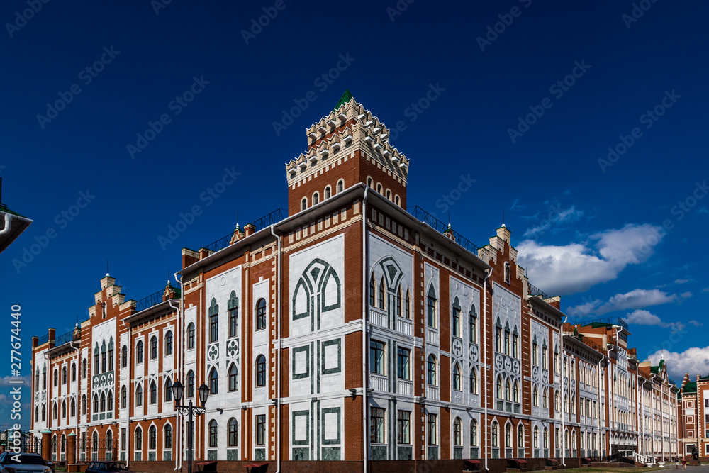 Fototapeta premium beautiful gothic house illuminated by the bright summer sun